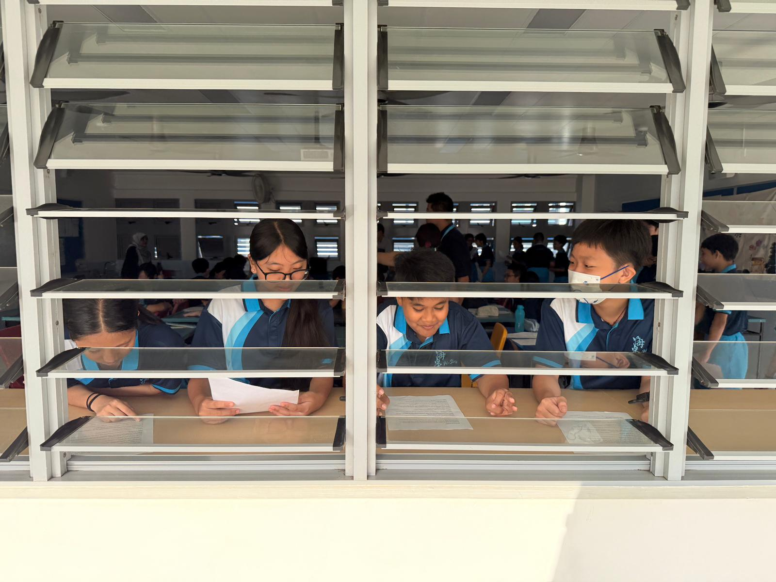 Students engaging in a role-play discussion activity.